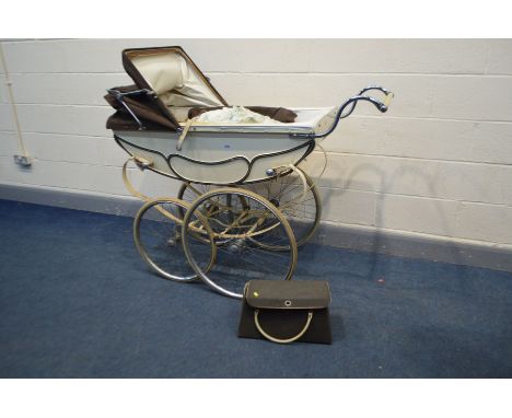 A VINTAGE MANTON PRAM/PERAMBULATOR, with carry case and attachable umbrella (condition - leather strap perished, carriage not