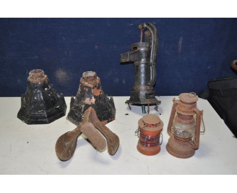 A SMALL CAST IRON WATER PUMP 41cm high, two cast iron rain hoppers, a Tilly lamp, a small paraffin lamp with a red lens and a