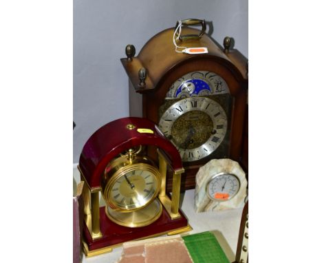A FRANZ HERMLE WESTMINSTER EIGHT DAY BRACKET CLOCK WITH MOON PHASE DISPLAY, the silvered chapter ring having Roman numerals, 
