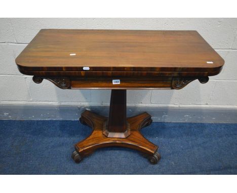 A VICTORIAN ROSEWOOD CARD TABLE, the fold over top enclosing a green baized playing surface, on a square tapered support with