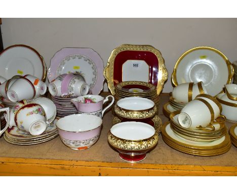 FIVE ASSORTED PART TEA SETS INCLUDING A ROYAL DOULTON CREAM AND GILT PATTERN, No.BB2039/H2908, comprising five cups (two crac