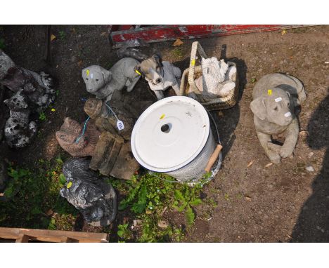 SEVEN SMALL GARDEN FIGURES AND A ENAMEL LIDDED BUCKET including a composite elderly gent on a bench, four composite dogs, a p