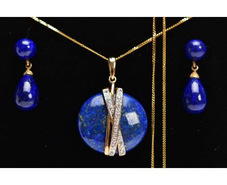 A YELLOW METAL LAPIS LAZULI AND DIAMOND PENDANT NECKLACE AND EARRING GIFT SET, the pendant designed with a polished circular 