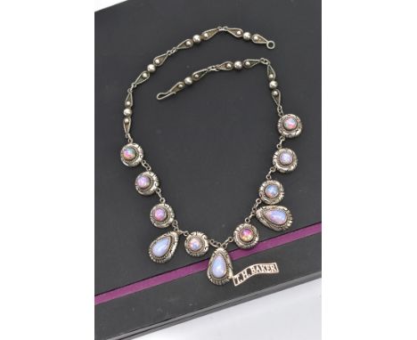 A WHITE METAL AND FAUX OPAL CABOCHON NECKLET, designed with eight circular links each set with a faux opal cabochon in a coll