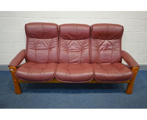 AN EKORNES STRESSES BURGUNDY LEATHER RECLINING SOFA, inner width 170cm x outer length 196cm