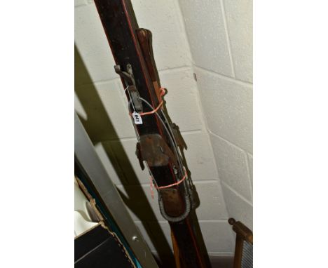 A PAIR OF VINTAGE WOODEN SKIS, with wooden poles and a wooden framed galvanised wash board (2)