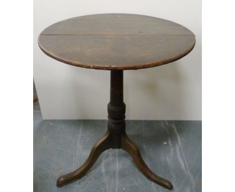 George III oak circular table, with saucer top on turned column and tripod base, 71cm high and 59cm wide.