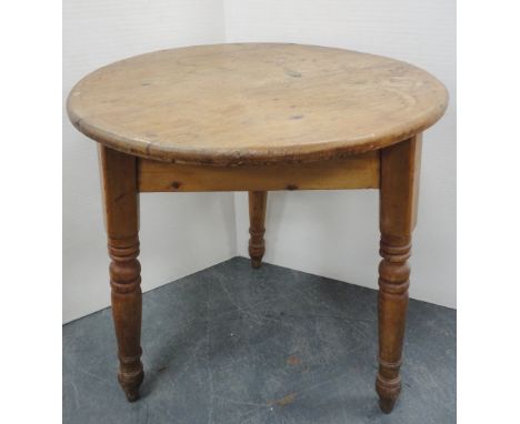 Late 19th century pine cricket table, on tripod turned supports, 76cm high and 66cm wide.CONDITION REPORT: There are age-rela