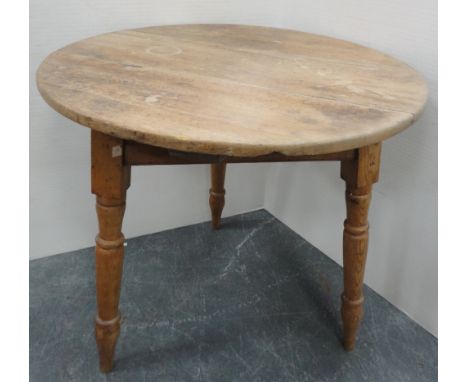 Late 19th century pine cricket table, on tripod turned supports, 72cm high and 66cm wide.CONDITION REPORT: There are age-rela