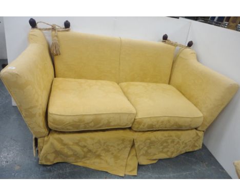 Knole-style sofa upholstered in gold floral fabric, with ties and cushions, 91cm high and 181cm wide.