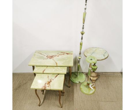 A nest of three faux onyx tables together with a faux onyx circular table, smoker's stand and matching standard lamp, largest