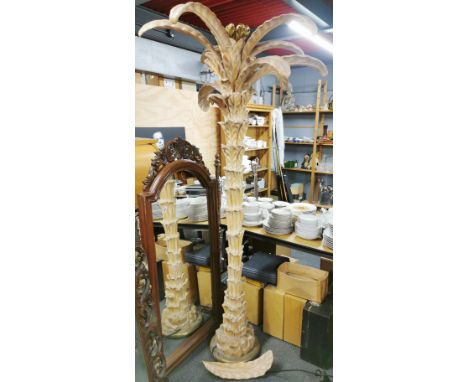 An impressive carved wooden two section palm tree standard lamp, A/F to one leaf, overall H. 210cm.