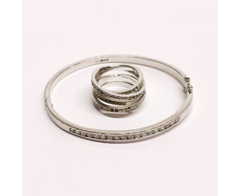 A silver stone set bangle with a further silver stoneset ring.