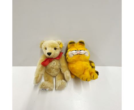 A Steiff classic teddy bear, H. 34cm.Together with a Garfield toy.