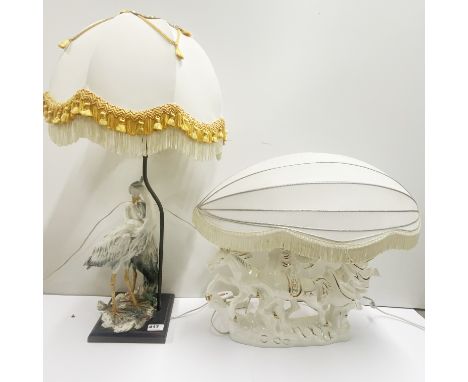A resin table lamp and shade with a further porcelain table lamp and shade, tallest 73cm.
