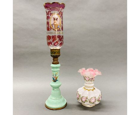 A 19thC French opaline glass oil lamp with a decorative glass shade, H. 56cm. together with a further opaline glass vase.