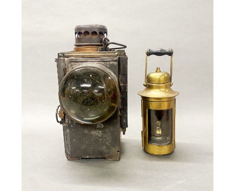 An early railway signalling lamp and a brass lamp.