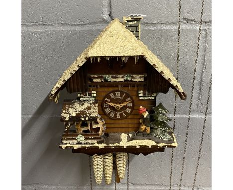 A vintage Schneider wooden winter cuckoo clock, H. 45cm.