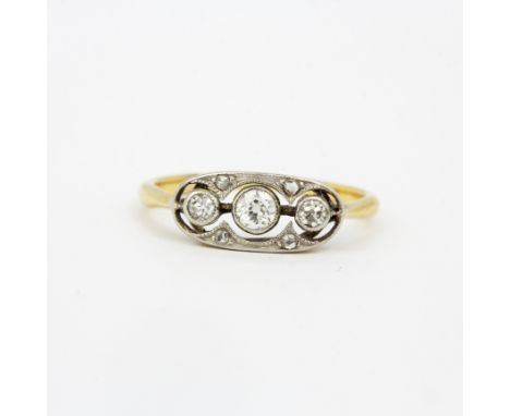 A yellow and white metal (tested minimum 9ct gold) diamond set ring, (K.5).