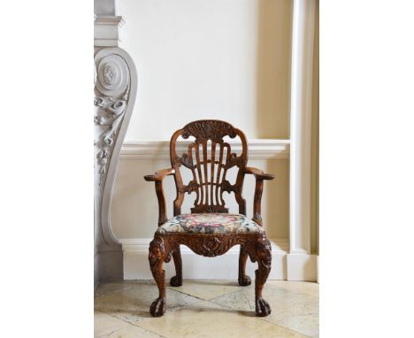 A GEORGE II CARVED WALNUT OPEN ARMCHAIR ATTRIBUTED TO DANIEL BELL AND THOMAS MOORE, CIRCA 1735102cm high, 72cm wide, 59cm dee