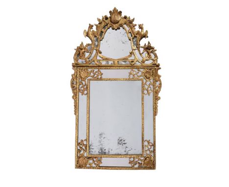 A REGENCE GILTWOOD WALL MIRRORCIRCA 1720The crest detachable, painted verso with an inventory mark 'D'130cm high, 81cm widePr