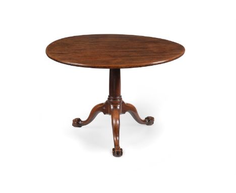 A GEORGE II MAHOGANY TRIPOD SUPPER TABLECIRCA 1750The circular top above a 'gun barrel' turned pillar, the tripod base with o