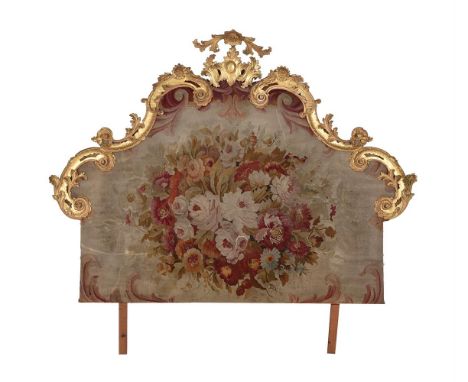 A CONTINENTAL CARVED GILTWOOD AND AUBUSSON NEEDLEWORK INSET BED HEADLATE 18TH/19TH CENTURYthe tapestry element and cresting a