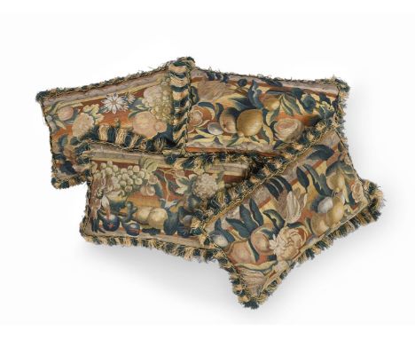 A SET OF FOUR TAPESTRY COVERED CUSHIONS FRENCH, EARLY 18TH CENTURY AND LATER ADAPTED Each incorporating front panels taken fr