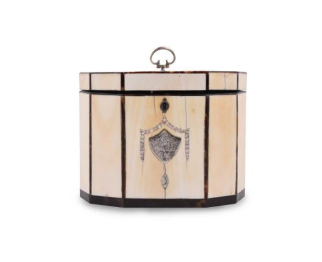 Y A GEORGE III IVORY AND MOTHER-OF-PEARL TEA CADDY CIRCA 1800 Of elongated octagonal form with inset armorial white metal shi