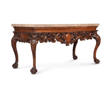 A CARVED WALNUT AND MARBLE MOUNTED CONSOLE TABLEIN IRISH GEORGE II STYLE, SOME POSSIBLE 18TH CENTURY ELEMENTSWith marble top 