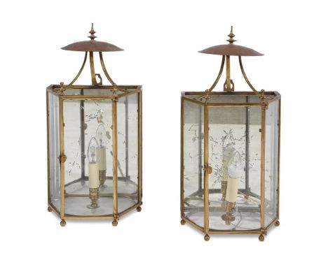 A PAIR OF GLAZED, BRASS FRAMED AND MIRROR BACKED WALL LANTERNS 20TH CENTURY Each with raised dome reflector above single door