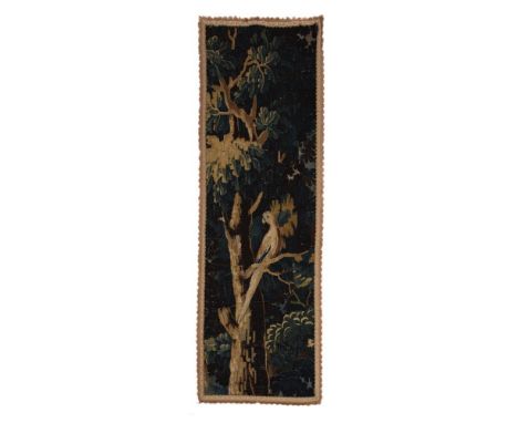 A CONTINENTAL VERDURE TAPESTRY PANEL LATE 17TH CENTURY Fragment from a larger wall panel, central bird in tree design146 x 50