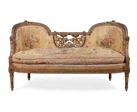 A FRENCH CARVED GILTWOOD AND TAPESTRY UPHOLSTERED SETTEE IN LOUIS XVI STYLE, THIRD QUARTER 19TH CENTURY The underside with la