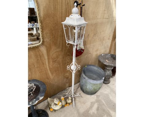 A DECORATIVE WROUGHT IRON STANDARD LAMP 