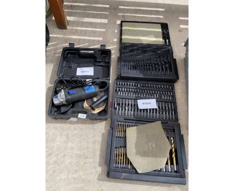AN ELECTRIC GRINDER AND THREE DRILL BIT SETS 