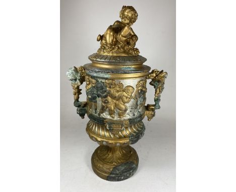 AN UNUSUAL 19TH CENTURY PEDESTAL BRONZE URN WITH NEO-CLASSICAL RELIEF DESIGN ON FLUTED BASE WITH CHERUB FIGURAL LID, WITH VER