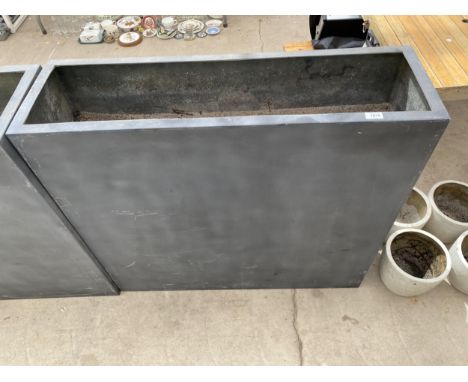 A TALL BLACK RECTANGULAR FIBRE GLASS TROUGH PLANTER (100CM x 90CM x 30CM) 