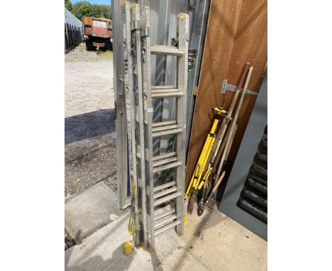 A THREE SECTION 18 RUNG ADJUSTABLE ALUMINIUM LADDER 