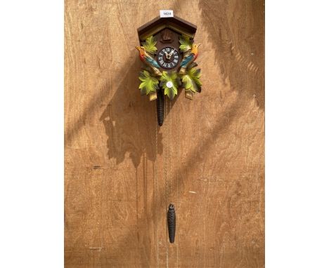 A WOODEN CUCKOO CLOCK 