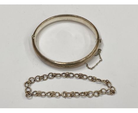 TWO SILVER BRACELETS TO INCLUDE HALLMARKED CHILD'S BANGLE AND OTHER DECORATIVE EXAMPLE 