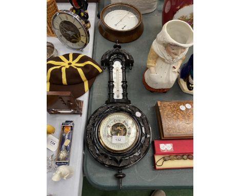 AN EBONY FRAMED VINTAGE BAROMETER AND THERMOMETER PLUS A ROUND METAL BAROMETER 