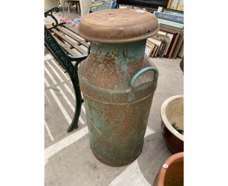 A VINTAGE CAST IRON MILK CHURN WITH LID 