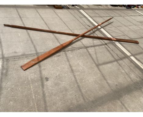 A LARGE PAIR OF VINTAGE WOODEN BOAT OARS 