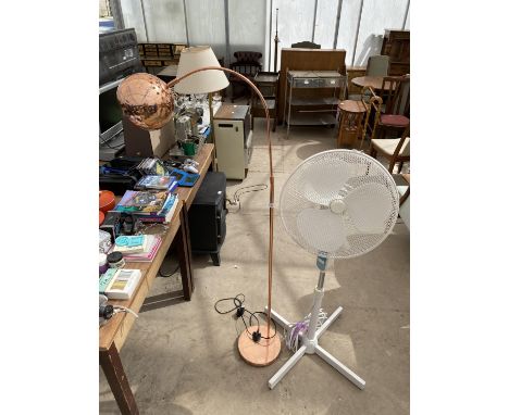 A TALL FAN AND A METAL STANDARD LAMP 