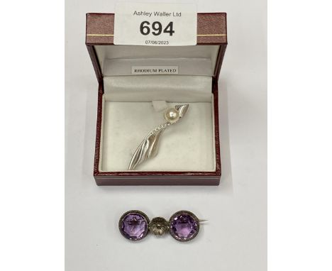 TWO BROOCHES TO INCLUDE VINTAGE AMETHYST STYLE TWO STONE EXAMPLE AND BOXED RHODIUM PLATED EXAMPLE 