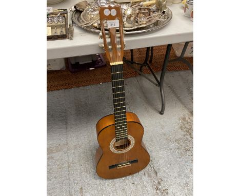 A VINTAGE WOODEN ACOUSTIC GUITAR 