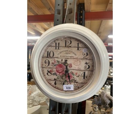 A VINTAGE STYLE 'LA BOUTIQUE DE FLEURS' WALL CLOCK 