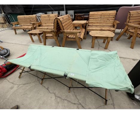 A VINTAGE CANVAS CAMPING BED AND FRAME 