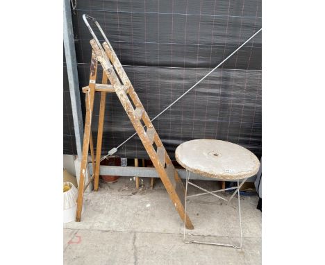 A VINTAGE FIVE RUNG WOODEN STEP LADDER AND A METAL FOLDING GARDEN TABLE 