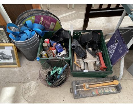 AN ASSORTMENT OF TOOLS AND HARDWARE TO INCLUDE TROWELS AND A TILE CUTTER ETC 
